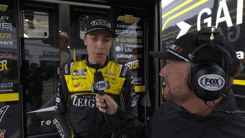 Man With Fox Sports Headset Talking To Race Car Driver GIF