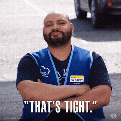 Man With Garrett Name Tag Crosses Arms GIF