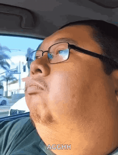 Man With Glasses And Beard Driving Car GIF