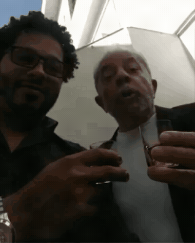 Man With Glasses And Beard Holding Glass GIF