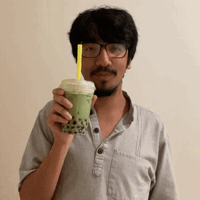 Man With Glasses And Beard Holding Green Tea GIF