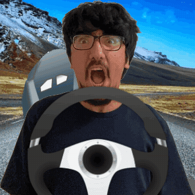 Man With Glasses And Beard Holding Steering Wheel In Mouth GIF