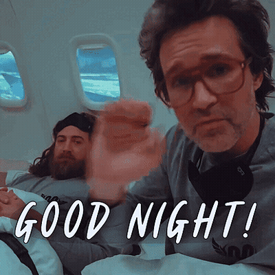 Man With Glasses And Beard In Bed Saying Good Night GIF
