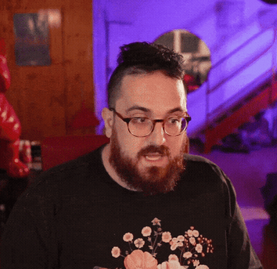 Man With Glasses And Beard In Black Floral Shirt GIF