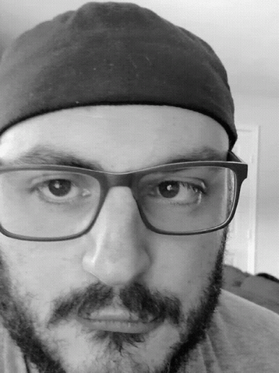 Man With Glasses And Beard In Black Hat GIF