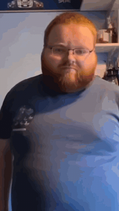 Man With Glasses And Beard In Blue Shirt GIF
