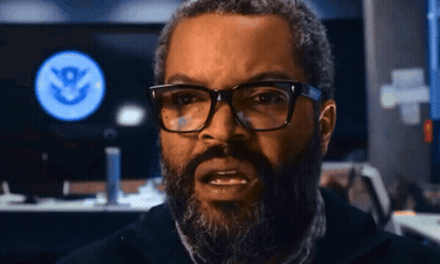 Man With Glasses And Beard In Front Of Screen With S GIF