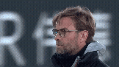Man With Glasses And Beard In Front Of Sign Saying Re GIF