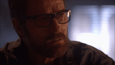 Man With Glasses And Beard Looking At Camera GIF