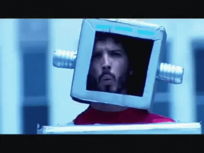 Man With Glasses And Beard Looking At Reflection GIF