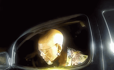 Man With Glasses And Beard Looking Out Car Window GIF