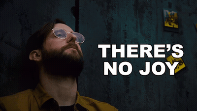 Man With Glasses And Beard Looking Up At There's No Joy GIF