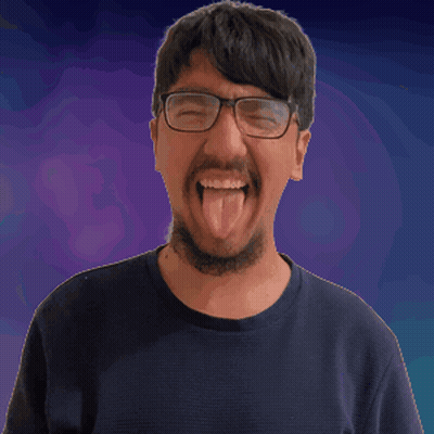 Man With Glasses And Beard Looks At Camera GIF