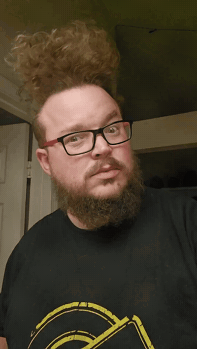 Man With Glasses And Beard Looks Surprised GIF