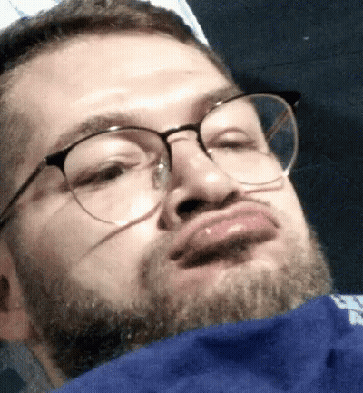 Man With Glasses And Beard Making Face GIF
