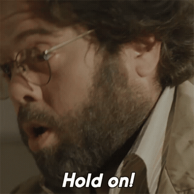 Man With Glasses And Beard Saying Hold On GIF