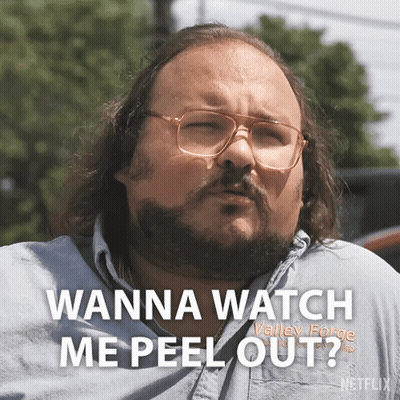 Man With Glasses And Beard Saying Wanna Watch Me Peel Out GIF