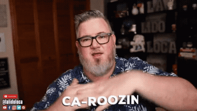 Man With Glasses And Beard Says Carousin GIF