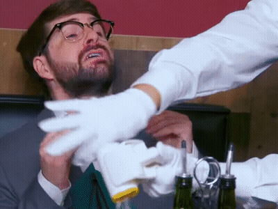 Man With Glasses And Beard Served By Waiter In White Gloves GIF