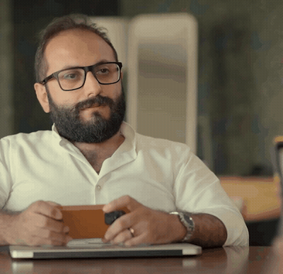 Man With Glasses And Beard Sitting At Laptop GIF