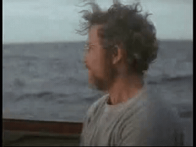 Man With Glasses And Beard Sitting On Boat GIF