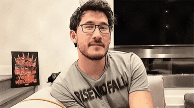 Man With Glasses And Beard Sitting On Couch In Front Of TV GIF