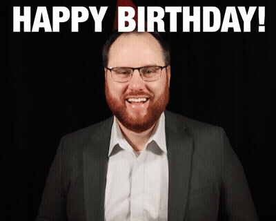 Man With Glasses And Beard Smiling Happy Birthday Sign GIF