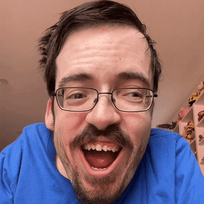 Man With Glasses and Beard Smiling Mouth Wide Open