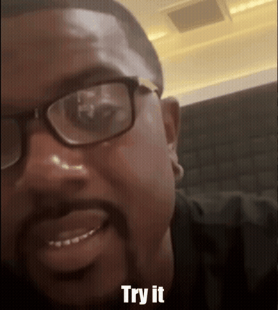 Man With Glasses And Beard Smiling Says Try It GIF