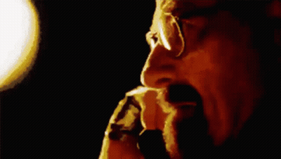 Man With Glasses And Beard Smoking Cigarette GIF