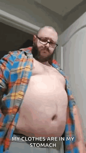 Man With Glasses And Beard Taking Off Shirt GIF