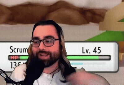 Man With Glasses And Beard Talking Into Microphone In Front Of Scrum LV 45 Screen GIF