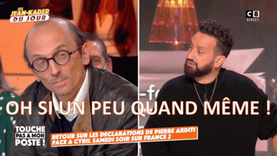 Man With Glasses and Beard Talks to Bearded Man