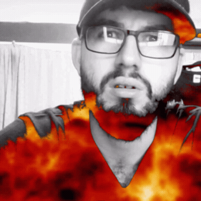 Man With Glasses And Beard Wearing Flame Hat GIF