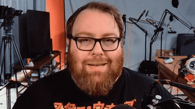 Man With Glasses And Beard Wearing Nintendo Shirt GIF
