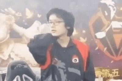 Man With Glasses And Black Jacket Near Statue GIF