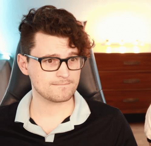 Man With Glasses And Black Shirt Looking To Side GIF