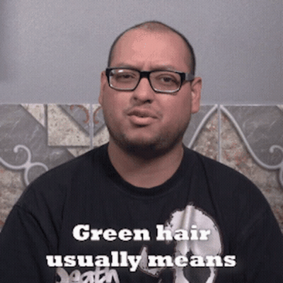 Man With Glasses and Black Shirt Says Green Hair Usually Means