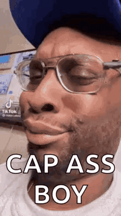 Man With Glasses And Blue Hat Making Funny Face GIF