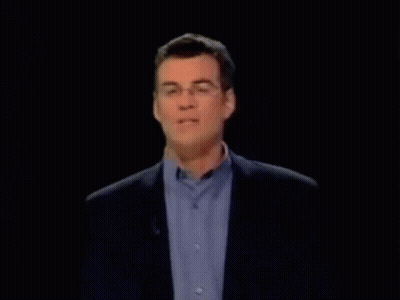 Man With Glasses And Blue Shirt On Microphone GIF