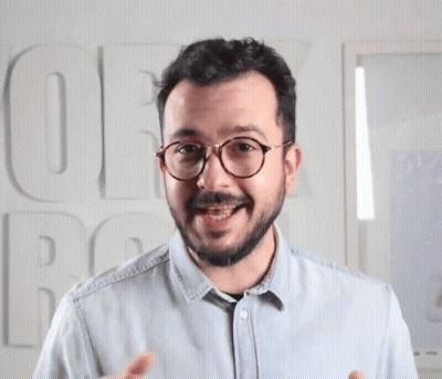 Man With Glasses And Blue Shirt Saying OE GIF