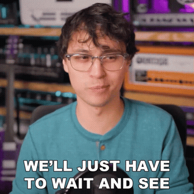 Man With Glasses And Blue Shirt Says We'll Just Have To Wait And See GIF