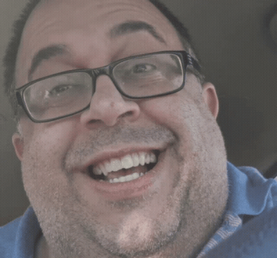 Man With Glasses And Blue Shirt Smiling GIF
