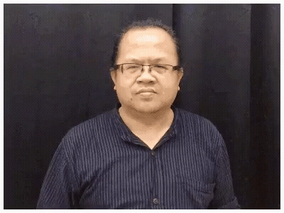 Man With Glasses And Blue Striped Shirt Making Funny Face And Saying Mignon-Ne GIF