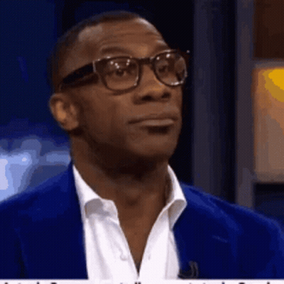 Man With Glasses And Blue Suit Looking GIF