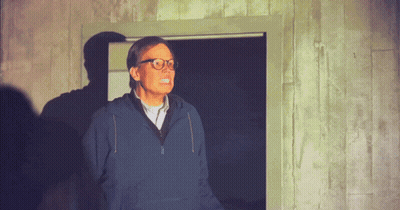 Man With Glasses And Blue Sweatshirt In Doorway GIF