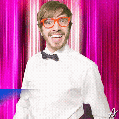 Man With Glasses And Bow Tie Smiling On Pink Background GIF