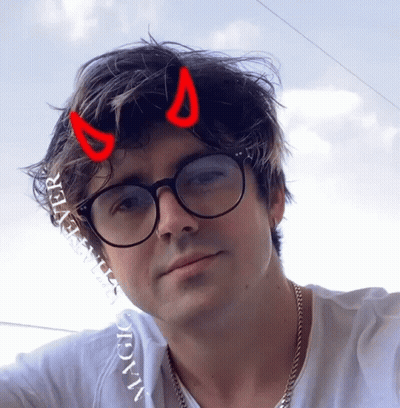 Man With Glasses And Devil Horns In Hair GIF