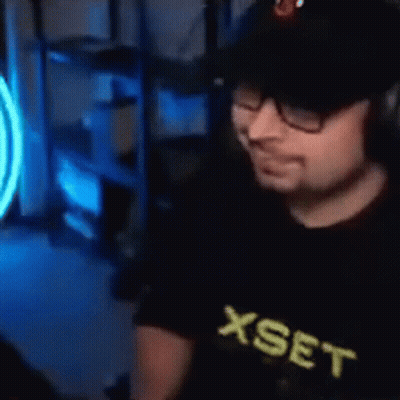 Man With Glasses And Hat At Computer GIF