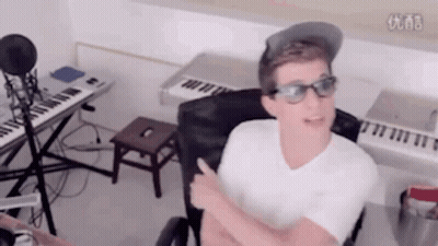 Man With Glasses And Hat At Microphone And Keyboard GIF